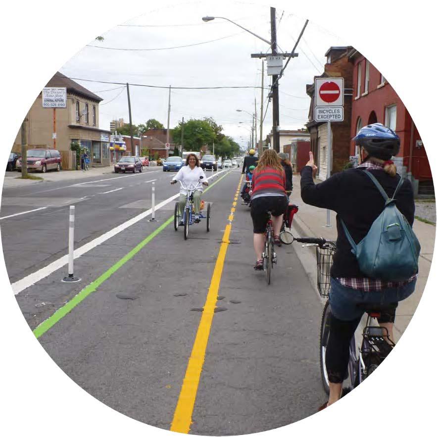 from two-way bicycle traffic on the west side of the street to conventional bike lanes with northbound cyclists