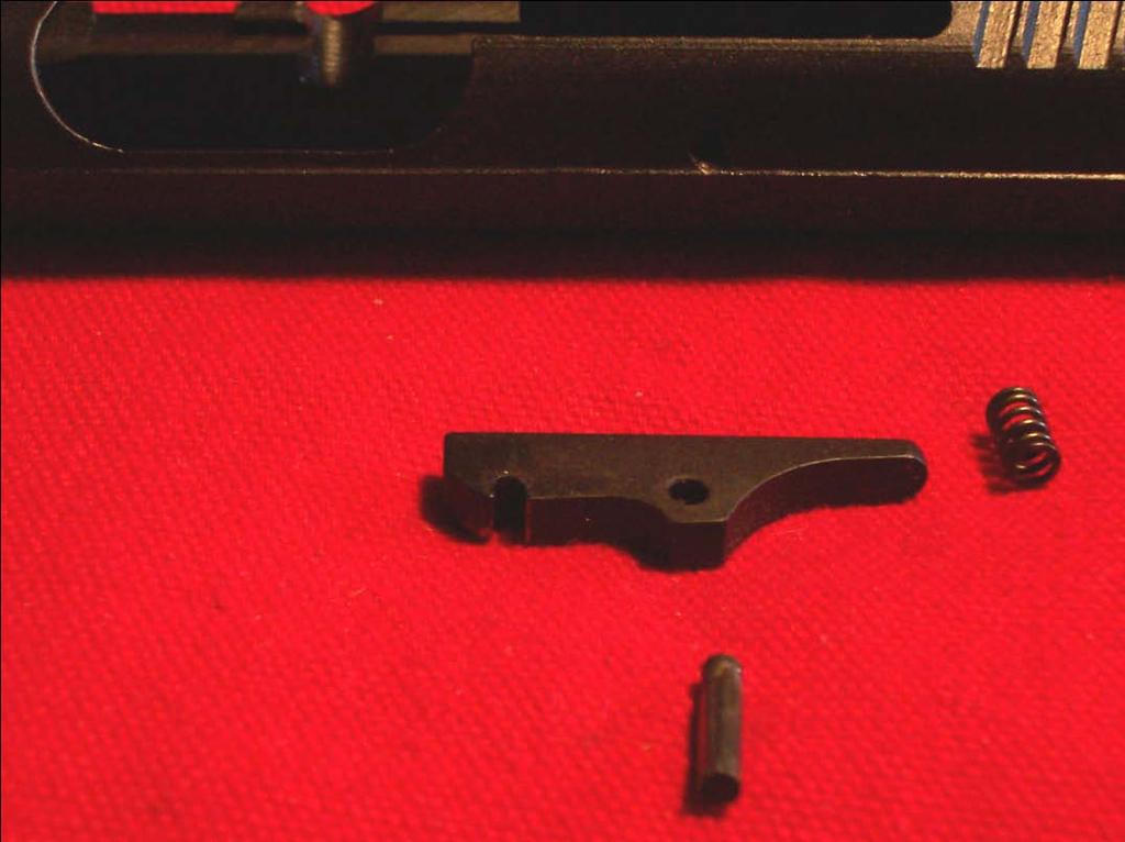 Figure 2-1B. Extractor Assembly Removed c) The rear sight (36) may be drifted out from either direction using a pin punch. Use care not to scratch the slide (37). 3.