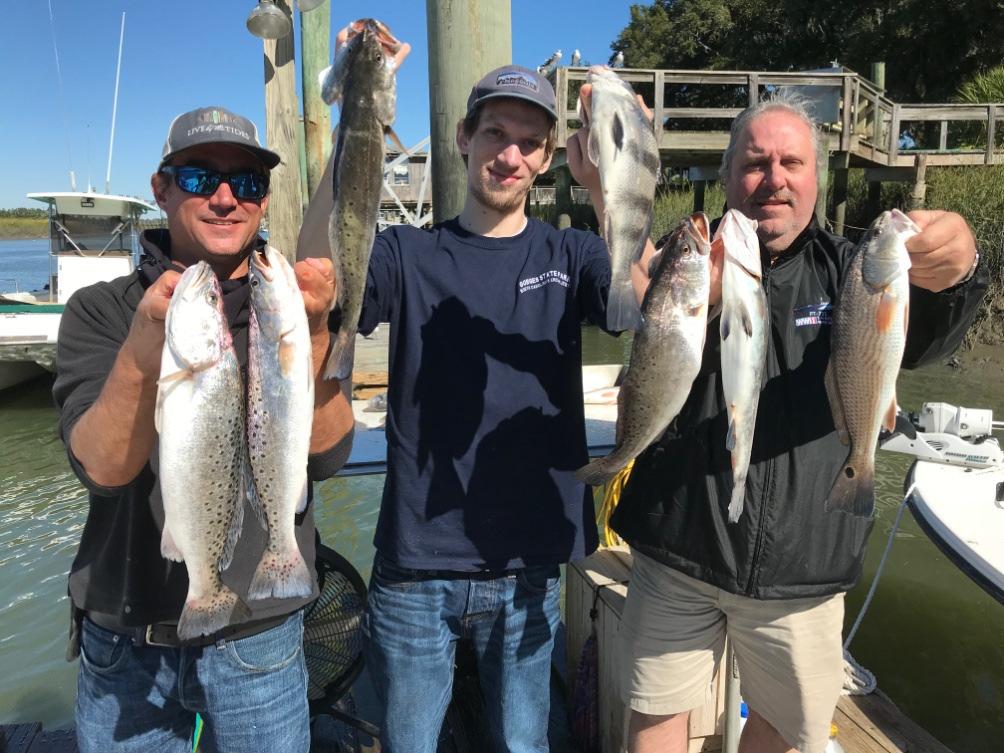 From left to right: Captain Kevin Rose of Miss Judy Charters, (holding two nice spotted sea trout) Paulie Smalls Savannah Georgia, holding spotted sea trout and a black drum) and Jim Rapkin Grayson