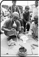 Snake Charmer Most snake charmers live in India and in countries of the Far East. Generally crowds come to watch them do many interesting acts at fairs, or at the market place.