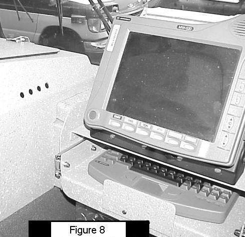 OFFICER S SIDE DASHBOARD: The M.D.C. is mounted directly in front of the Officer s seat where the glove box would normally be located Figure 8. A special module was designed for mounting the M.D.C. which includes a slide-out tray for the keyboard.