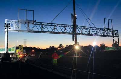 The gantry was hoisted into position by a large crane with the help of a team of experts in harnesses that fi xed it into place. It took several hours to position and secure the structure.