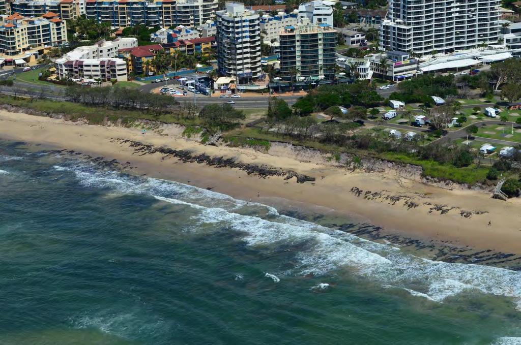 Figure 6.10, below, is a photograph looking south at Maroochydore beach, showing exposed coffee rock, beach access infrastructure and dunes prior to erosion that occurred early 2013. Figure 6.