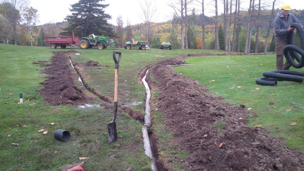 This project began in the middle section from the edge of #5 fairway to the 6/7 pathway (378 feet long). This stretch had a 43 inch drop and 1.2% slope.