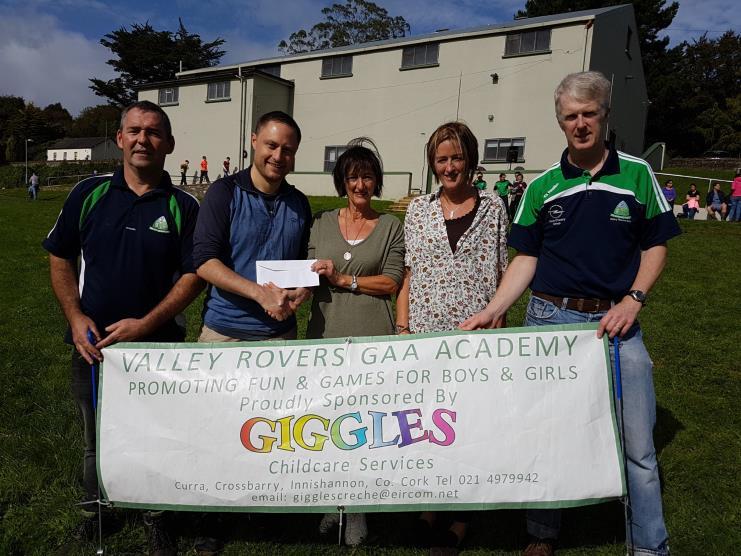 was a great success. Pictured Above: Marie Kerr and Bernice Lynch of Giggles Creche in Crossbarry presenting their sponsorship cheque to Pio Murphy of the Valley Rovers GAA Academy.