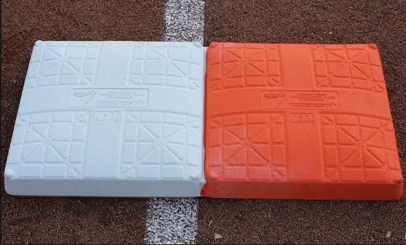 Safety Base The safety base is a double base used at 1 st base. Half the base is secured in fair territory and half the base of a different colour (usually orange) is secured in foul territory.