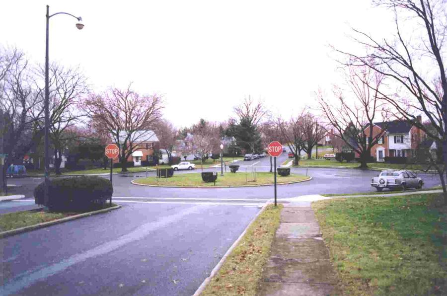 Control of a traffic circle is typically uncontrolled or stop controlled (as shown at left). Some traffic circles allow parking within the circular roadway of the intersection.
