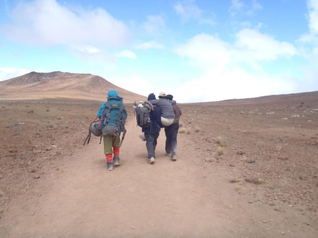 This picture was when we began to descend Kilimanjaro on the fifth day of our climb. My daughter, Anna, actually reached Uhuru Peak, the summit of Kilimanjaro.