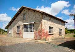 Charente, France. Substantial stone built forge suitable for conversion to a house (has had outline planning) with large modern workshop and approximately 1/4 acre of lawn.