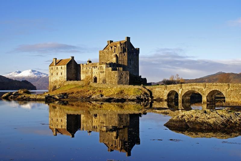 1. Eilean Donan Castle Eilean Donan is an old favourite. It in a spectacular setting in the middle of 3 lochs and (surround) by mountains.