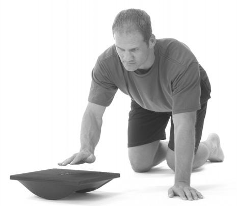 Assume push-up position with knees on floor, and hands stabilized on sides of Rocker Board.
