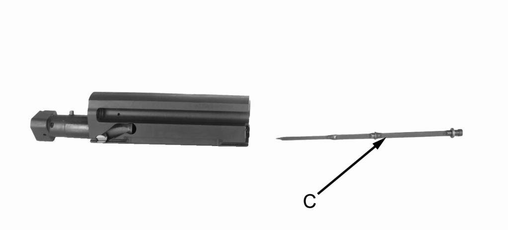 Push in on detent (B) and rotate firing pin