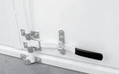 Stick a length of foam tape inside the door