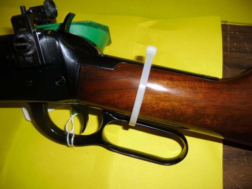 HAMMERLESS LEVER ACTION RIFLES, OR THOSE WHICH HAVE A SMOOTH HAMMER THAT WILL NOT PREVENT A ZIP TIE FROM SLIPPING