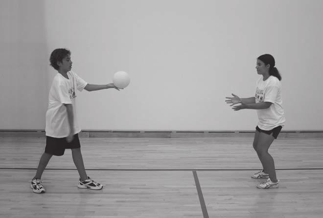 Step towards target with your opposite foot, then swing serving hand forward.