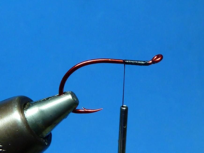 Preparing a weed guard for a tube fly hook.