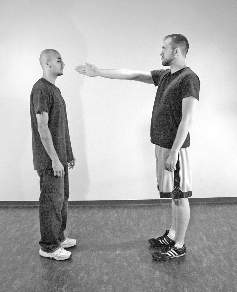 You should make eye contact at the beginning of the fight and at the beginning of each move or series of moves, whenever it makes practical sense.