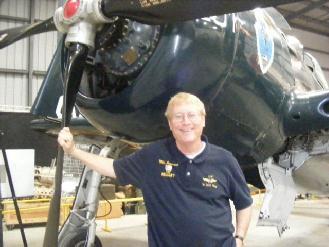 Mike Perrenoud New Maintenance Officer by Dave Flood Photo by Dave Flood Mike Perrenoud, in front of our F8F-2 Bearcat, whose new engine he worked on diligently for many months.