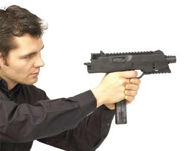handling and operator procedures firing position 1) The weapon is fired single handed or with both hands on the pistol grip (Fig. 1.9).