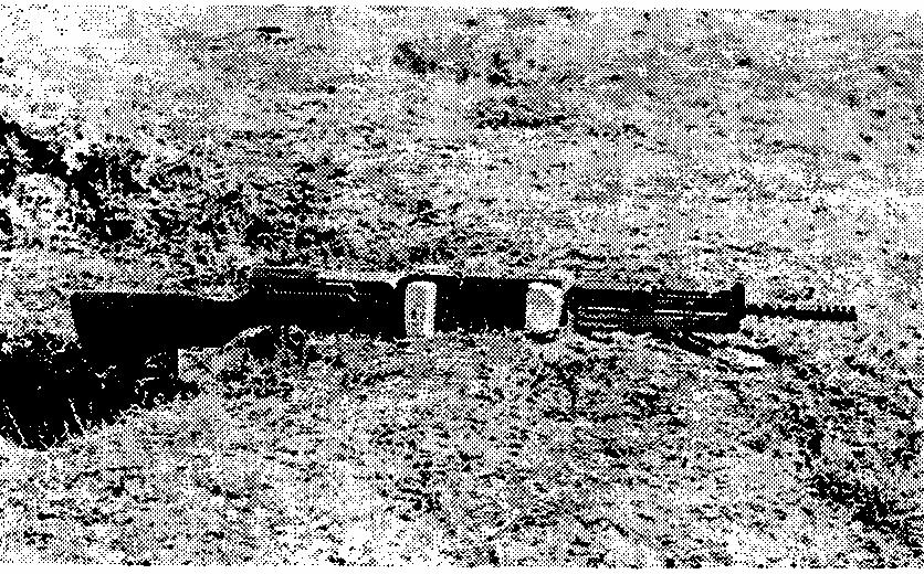 The semi-automatic rifle can also be prepared with straight sticks and by carving out a trough in the parapet of the trench.
