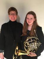 MUSIC NEWS Sophomore Caitlin Murphy participated in the UNL Winter Festival for Winds and Percussion held January 19-21 on the UNL campus. She is pictured here with the director, Dr. Barber, of UNL.