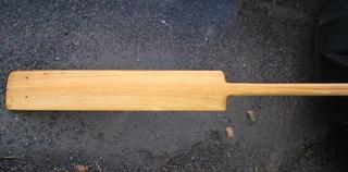A paddle like this is very easy to make out of a 5' length of some 1" x 4" straight grained plank of some lightweight wood.