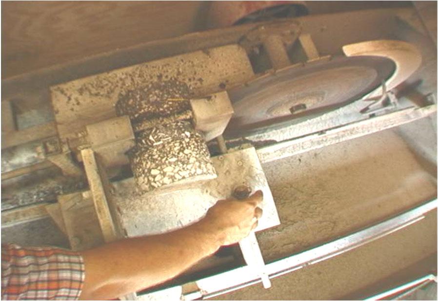 If samples are cores, they are trimmed (cut, bottom only) so that the top and bottom are approximately parallel. The majority of the lift is to be tested.