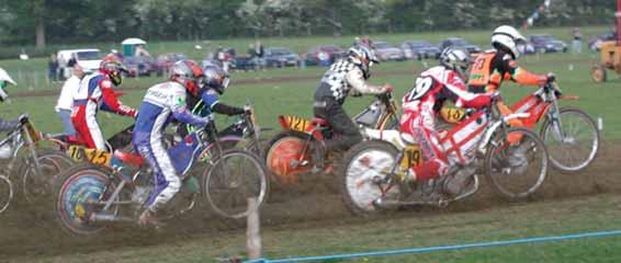 machines similar to speedway bikes on an oval grass circuit.