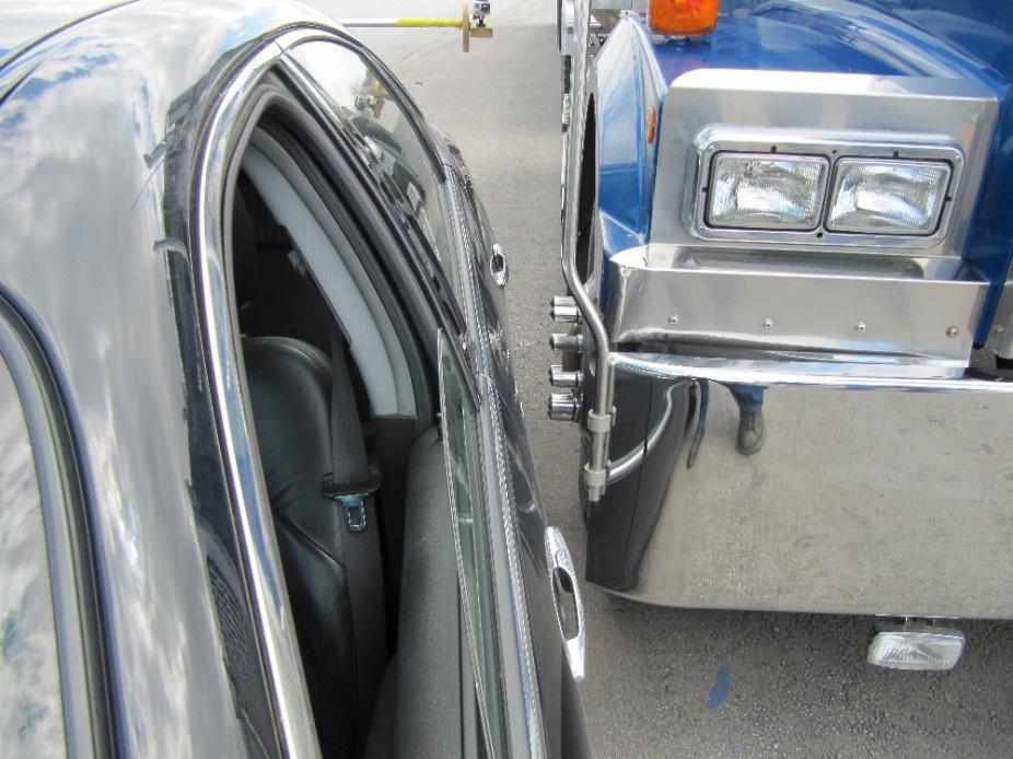Figure 2: View showing close proximity of the left side of the Buick next to the right front wheel of the truck.