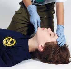 Then, open the airway by pressing (or tilting) on the forehead with one hand and lifting the chin with the other to tilt back the head.