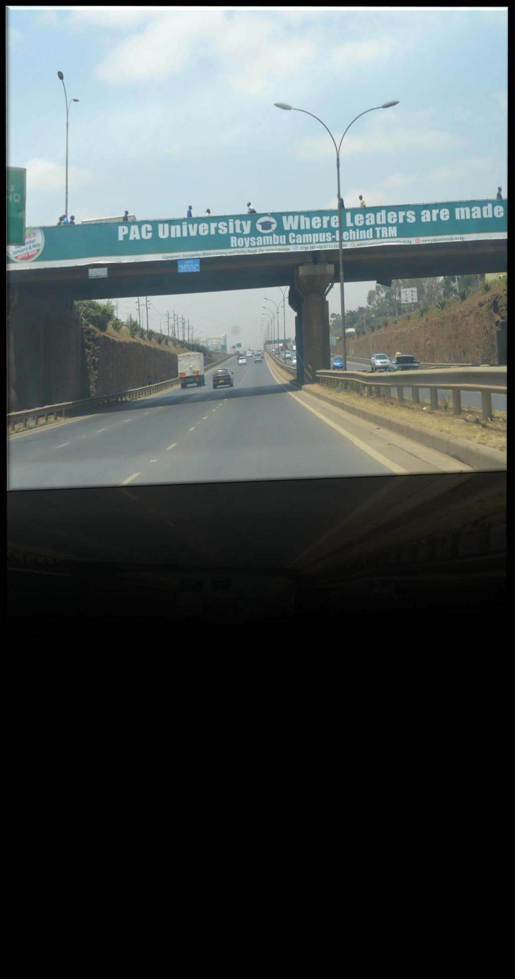 Nairobi-Thika Road Sign showing a universityoff Nairobi- Thika Road