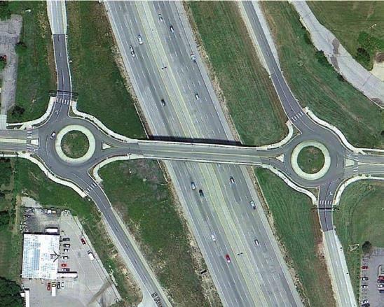 roundabouts on both sides, or a large round roundabout that is under or over the freeway that uses two separate bridges to span the circulating roadway. Some examples of are shown below. Figure 10.