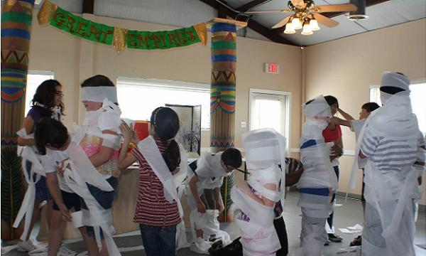 Students then have to cross over without toppling off into the pit of spiders! Mummy Wrap Put your students into teams.