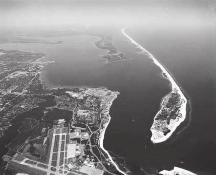 A barrier spit is a sandbar that sticks up above the water and is connected to the shoreline. Cape Cod, Massachusetts, is an example of a barrier spit. It is shown in the figure below. 11.