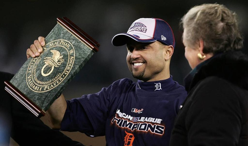 DETROIT - OCTOBER 14: AL Playoff MVP Placido Polanco #14 of the Detroit Tigers holds the MVP trophy after the TIgers won 6-3 against the Oakland Athletics during Game Four of the American League