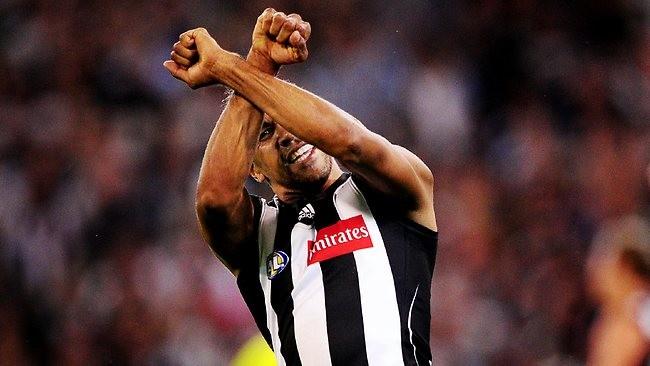 Andrew Krakouer gesturing during a game with Collingwood in 2011, acknowledging his time in prison and inmates.