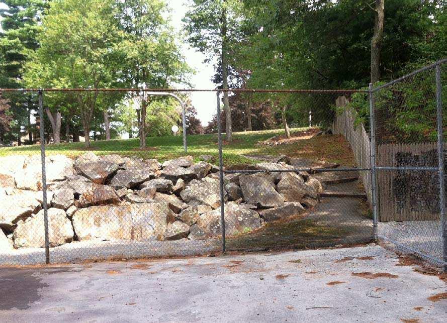 The existing access up the railroad tie and asphalt walk is