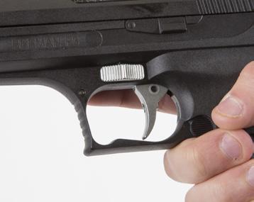 The P3 has an automatic safety located above the trigger blade (Fig. 5). FIG.