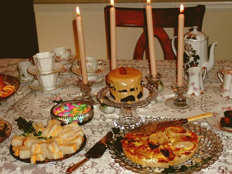 She prepared a classic summer tea with finger sandwiches, onion pie, chocolate cake, and other petite goodies.